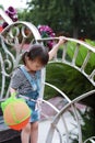 Aisa cute naughty lovely child girl play with balloon have fun outdoor in summer park happy smile happiness funny childhood Royalty Free Stock Photo