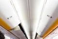 Aisle of a Boeing plane from the inside. Royalty Free Stock Photo