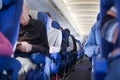 Aisle between seats in airplane cabin Royalty Free Stock Photo