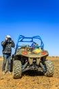 Ait Saoun, Morocco - February 23, 2016: Man preparing to ride a quad bike along the sandy desert Royalty Free Stock Photo