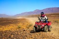 Ait Saoun, Morocco - February 22, 2016: Man riding quad bike on sand Royalty Free Stock Photo