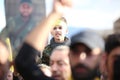 Hezbollah`s child supporter Carries the flag of Hezbollah Royalty Free Stock Photo