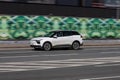 Aiways U5 is all-electric battery-powered compact crossover SUV manufactured by the Chinese company. White EV car in motion on Royalty Free Stock Photo