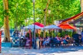 AIX-EN-PROVENCE, FRANCE, JUNE 18, 2017: People are strolling on cours Mirabeau in the center of Aix-en-Provence, France Royalty Free Stock Photo