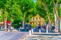 AIX-EN-PROVENCE, FRANCE, JUNE 18, 2017: People are strolling on cours Mirabeau in the center of Aix-en-Provence, France Royalty Free Stock Photo