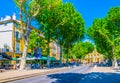 AIX-EN-PROVENCE, FRANCE, JUNE 18, 2017: People are strolling on cours Mirabeau in the center of Aix-en-Provence, France Royalty Free Stock Photo