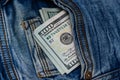 100 dollar bills in the pocket of blue jeans, studio shooting Royalty Free Stock Photo