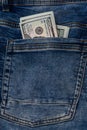 100 dollar bills in the pocket of blue jeans, studio shooting Royalty Free Stock Photo