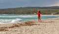 Young woman lifeguard on duty at Corsica beach, France