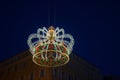 A neon light imperial crown in honor of French Emperor Napoleon I suspended in the air above Ajaccio , France