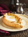 Ajarian khachapuri - traditional dish of georgian cuisine.