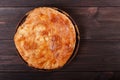 Ajarian Khachapuri traditional Georgian cheese pastry on cutting board. Homemade baking. Top view.