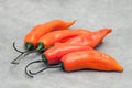 Aji amarillo hot chili peppers on stone background Royalty Free Stock Photo