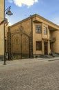 House in the city of Gyumri with forged gates with a monogram and a forged balcony in a niche on Abovyan street