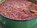 Ajvar in a large pot - preparing process of making traditional seasonal Balkan food Royalty Free Stock Photo