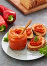 Ajvar pepper mousse in a jar and on a slices of bread