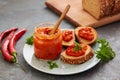 Ajvar pepper mousse in a jar and on a slices of bread Royalty Free Stock Photo