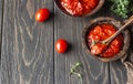 Ajvar pepper mousse or pindjur red vegetable spread made from paprika and tomatoes in wooden bowl on the rustic wooden table. Royalty Free Stock Photo