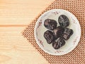 Ajwa Dates fruit on wooden table Royalty Free Stock Photo