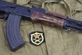 AK47 with Soviet Army Artillery shoulder patch on khaki uniform