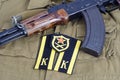 AK47 with Soviet Army Cadet shoulder mark and Soviet Army Artillery shoulder patch on khaki uniform Royalty Free Stock Photo