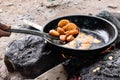 Akara Fried Bean Cake on fire in hot oil for street food concept