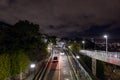 Akashi, Japan - December 12, 2022: Light traffic on quiet road through suburban neighborhood at night