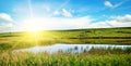 Ake overgrown with reeds. In the blue sky a bright sunrise. Wide photo Royalty Free Stock Photo