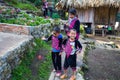 An Akha family pose for tourist photos at Doi Pui Mong Hill Tribe Village, Chiang Mai, Thailand Royalty Free Stock Photo