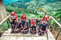 Akha hill tribe people sit and admire the view on Doi Mae Salong, Chiang Rai Province, Thailand. Royalty Free Stock Photo