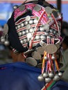 Akha woman from behind showing headdress, Muang Sing, Northern Laos