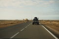 Akhfennir, Morocco - January 18, 2020: Camel crossing the road in the desert Royalty Free Stock Photo