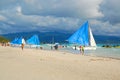Blue and white beach sail boats at Boracay Island in Aklan, Philippines Royalty Free Stock Photo