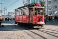 Aksim square during morning with red, vintage and retro style tram in istiklal street