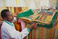 Man demonstrates ancient Bible in Amharic language in the church of Our Lady Mary of Zion, the most sacred place for all Orthodox