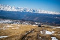 Aktash, Russia - May 9, 2022: Car on road to a repeater on snowy tops of Altai mountains near Aktash town, Russia