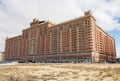 Large luxury residential complex Green Plaza in Aktau. Beautiful multi-storey house made of red brick.