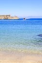 Akti sachtouri beach with Nailac tower on sea in Rhodes old town