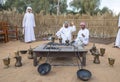Emirati men preparing coffee or qahwa as it is called locally