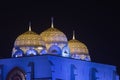 Al Ameen City Mosque glowing at night purple and yellow in Muscat, Oman Royalty Free Stock Photo