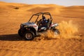 Male driver ride and drift buggy car, quad bike at desert sand dunes