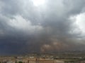 Al-Bahah region, dense clouds gather in a dramatic gray sky warning of rain on an autumn day with volatile weather Royalty Free Stock Photo