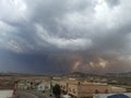 Al-Bahah region, dense clouds gather in a dramatic gray sky warning of rain on an autumn day with volatile weather Royalty Free Stock Photo