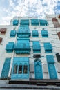 Al-Balad old town with traditional muslim houses with blue windows and balconies, Jeddah, Saudi Arabia