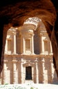 The Al-Deir Monastery in the mountains of Petra, Jordan, framed by the rocks of a cave