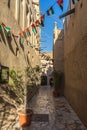 Al Fahidi Historical Neighbourhood surrounded by flags under the sunlight in UAE Royalty Free Stock Photo