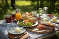 al fresco lunch picnic for two with tableware, glasses, and spreads