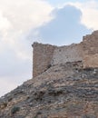 Round corner tower in the medieval fortress Ash Shubak, standing on a hill near Al Jaya city in Jordan
