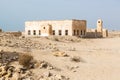 Al Jumail, Qatar. Abandoned town and mosque with minaret. The desert at coast of Persian Gulf. Royalty Free Stock Photo