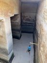 A man climbs the stairs to the top of the Little Petra in Jordan Pool in the rock